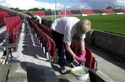 9 August 2001; Longford Town supporters wash seats prior to the gates opening for the UEFA Cup Qualifier First Leg match between Longford Town and Liteks Lovetch at Flancare Park in Longford. Photo by David Maher/Sportsfile