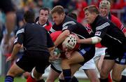 10 August 2001; Anthony Foley of Munster is tackled by Bath players, Andy Beaty, centre Dan Lyle, right, and Tom Voyce during the Friendly match between Munster and Bath at Thomond Park in Limerick. Photo by Matt Browne/Sportsfile