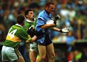 11 August 2001; Peadar Andrews of Dublin is tackled by Aodán Mac Gearailt and Dara Ó Cinnéide, 14, of Kerry during the Bank of Ireland All-Ireland Senior Football Championship Quarter-Final Replay match between Dublin and Kerry at Semple Stadium in Thurles, Tipperary. Photo by Ray McManus/Sportsfile