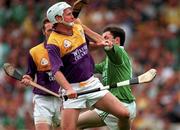 1 September 1996; Tom Dempsey of Wexford in action against Declan Nash of Limerick during the Guinness All-Ireland Senior Hurling Championship Final match between Wexford and Limerick at Croke Park in Dublin. Photo by Ray McManus/Sportsfile