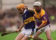 12 August 2001; Paul Ormonde of Tipperary in action against Paul Codd of Wexford during the Guinness All-Ireland Senior Hurling Championship Semi-Final match between Wexford and Tipperary at Croke Park in Dublin. Photo by Brian Lawless/Sportsfile
