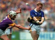 12 August 2001; Declan Ryan of Tipperary is tackled by David O'Connor of Wexford during the Guinness All-Ireland Senior Hurling Championship Semi-Final match between Wexford and Tipperary at Croke Park in Dublin. Photo by Damien Eagers/Sportsfile
