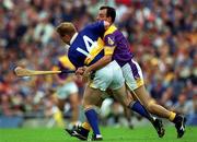 12 August 2001; Declan Ryan of Tipperary is tackled by Darragh Ryan of Wexford during the Guinness All-Ireland Senior Hurling Championship Semi-Final match between Wexford and Tipperary at Croke Park in Dublin. Photo by Ray McManus/Sportsfile