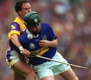 12 August 2001; David Kennedy of Tipperary in action against Adrian Fenlon of Wexford during the Guinness All-Ireland Senior Hurling Championship Semi-Final match between Wexford and Tipperary at Croke Park in Dublin. Photo by Ray McManus/Sportsfile