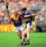 12 August 2001; Mark O'Leary of Tipperary in action against Michael Jordan of Wexford during the Guinness All-Ireland Senior Hurling Championship Semi-Final match between Wexford and Tipperary at Croke Park in Dublin. Photo by Damien Eagers/Sportsfile