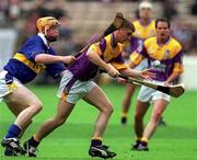 12 August 2001; Trevor Kelly of Wexford Eamonn Corcoran of Tipperary during the Guinness All-Ireland Senior Hurling Championship Semi-Final match between Wexford and Tipperary at Croke Park in Dublin. Photo by Damien Eagers/Sportsfile