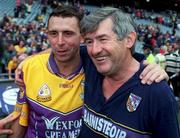 12 August 2001; Wexford manager Tony Dempsey congratulates two-time goalscorer Larry O'Gorman after the drawn Guinness All-Ireland Senior Hurling Championship Semi-Final match between Wexford and Tipperary at Croke Park in Dublin. Photo by Damien Eagers/Sportsfile