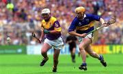 12 August 2001; Paul Codd of Wexford in action against Paul Ormonde of Tipperary during the Guinness All-Ireland Senior Hurling Championship Semi-Final match between Wexford and Tipperary at Croke Park in Dublin. Photo by Brian Lawless/Sportsfile
