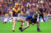12 August 2001; Thomas Costello of Tipperary in action against Michael Jordan of Wexford during the Guinness All-Ireland Senior Hurling Championship Semi-Final match between Wexford and Tipperary at Croke Park in Dublin. Photo by Brian Lawless/Sportsfile