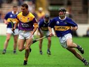 12 August 2001; Larry O'Gorman of Wexford in action against Mark O'Leary of Tipperary during the Guinness All-Ireland Senior Hurling Championship Semi-Final match between Wexford and Tipperary at Croke Park in Dublin. Photo by Damien Eagers/Sportsfile