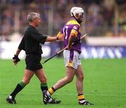 12 August 2001; Paul Codd of Wexford is asked to leave the field with a blood injury by referee Pat O'Connor during the Guinness All-Ireland Senior Hurling Championship Semi-Final match between Wexford and Tipperary at Croke Park in Dublin. Photo by Damien Eagers/Sportsfile