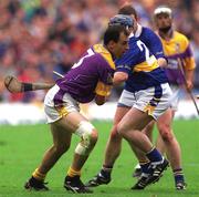 12 August 2001; Darragh Ryan of Wexford in action against Eugene O'Neill of Tipperary during the Guinness All-Ireland Senior Hurling Championship Semi-Final match between Wexford and Tipperary at Croke Park in Dublin. Photo by Damien Eagers/Sportsfile