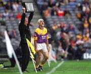 12 August 2001; Martin Storey of Wexford comes on as a substitute to replace team-mate Nicky Lambert during the Guinness All-Ireland Senior Hurling Championship Semi-Final match between Wexford and Tipperary at Croke Park in Dublin. Photo by Ray McManus/Sportsfile