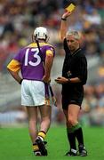 12 August 2001; Paul Codd of Wexford is shown the yellow card by referee Pat O'Connor during the Guinness All-Ireland Senior Hurling Championship Semi-Final match between Wexford and Tipperary at Croke Park in Dublin. Photo by Ray McManus/Sportsfile