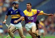 12 August 2001; Eoin Kelly of Tipperary in action against Larry O'Gorman of Wexford during the Guinness All-Ireland Senior Hurling Championship Semi-Final match between Wexford and Tipperary at Croke Park in Dublin. Photo by Ray McManus/Sportsfile