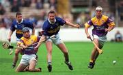 12 August 2001; Liam Dunne, left, and Declan Ruth of Wexford in action against Brian O'Meara and John Carroll, left, of Tipperary during the Guinness All-Ireland Senior Hurling Championship Semi-Final match between Wexford and Tipperary at Croke Park in Dublin. Photo by Damien Eagers/Sportsfile