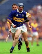 12 August 2001; Eoin Kelly of Tipperary gets past Larry O'Gorman of Wexford during the Guinness All-Ireland Senior Hurling Championship Semi-Final match between Wexford and Tipperary at Croke Park in Dublin. Photo by Ray McManus/Sportsfile