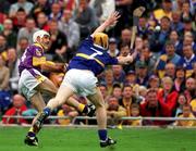 12 August 2001; Martin Storey of Wexford shoots under pressure from Eamonn Corcoran of Tipperary during the Guinness All-Ireland Senior Hurling Championship Semi-Final match between Wexford and Tipperary at Croke Park in Dublin. Photo by Damien Eagers/Sportsfile