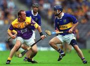 12 August 2001; Larry Murphy of Wexford in action against Paul Kelly of Tipperary during the Guinness All-Ireland Senior Hurling Championship Semi-Final match between Wexford and Tipperary at Croke Park in Dublin. Photo by Ray McManus/Sportsfile