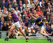 12 August 2001; David O'Connor of Wexford in action against Lar Corbett of Tipperary during the Guinness All-Ireland Senior Hurling Championship Semi-Final match between Wexford and Tipperary at Croke Park in Dublin. Photo by Damien Eagers/Sportsfile