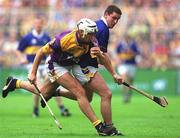 12 August 2001; David O'Connor of Wexford in action against John Carroll of Tipperary during the Guinness All-Ireland Senior Hurling Championship Semi-Final match between Wexford and Tipperary at Croke Park in Dublin. Photo by Damien Eagers/Sportsfile