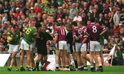 11 August 2001; Referee Paddy Russell attempts to separate players during the Bank of Ireland All-Ireland Senior Football Championship Quarter-Final Replay match between Meath and Westmeath at Croke Park in Dublin. Photo by Aoife Rice/Sportsfile