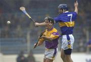 18 August 2001; Rory McCarthy of Wexford in action against Paul Kelly of Tipperary during the Guinness All-Ireland Senior Hurling Championship Semi-Final Replay match between Wexford and Tipperary at Croke Park in Dublin. Photo by Brendan Moran/Sportsfile