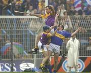 18 August 2001; Darragh Ryan of Wexford, top, and team-mate Liam Dunne in action against John Carroll of Tipperary during the Guinness All-Ireland Senior Hurling Championship Semi-Final Replay match between Wexford and Tipperary at Croke Park in Dublin. Photo by Brendan Moran/Sportsfile