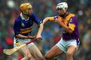 18 August 2001; David O'Connor of Wexford in action against Lar Corbett of Tipperary during the Guinness All-Ireland Senior Hurling Championship Semi-Final Replay match between Wexford and Tipperary at Croke Park in Dublin. Photo by Ray McManus/Sportsfile