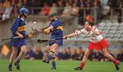 18 August 2001; Emer McDonnell of Tipperary in action against Paula O'Connor of Cork during the All-Ireland Senior Camogie Championship Semi-Final match between Cork and Tipperary at Cusack Park in Mullingar, Westmeath. Photo by Matt Browne/Sportsfile