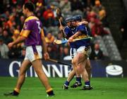 18 August 2001; Eugene O'Neill of Tipperary, right, celebrates with team-mate Eoin Kelly after scoring a goal, as Darragh Ryan of Wexford looks on, during the Guinness All-Ireland Senior Hurling Championship Semi-Final Replay match between Wexford and Tipperary at Croke Park in Dublin. Photo by Brendan Moran/Sportsfile