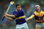 18 August 2001; John Carroll of Tipperary gets in his shot away despite the attentions of Declan Ruth of Wexford during the Guinness All-Ireland Senior Hurling Championship Semi-Final Replay match between Wexford and Tipperary at Croke Park in Dublin. Photo by Ray McManus/Sportsfile
