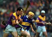 18 August 2001; Paul Ormonde of Tipperary is tackled by Darragh Ryan of Wexford during the Guinness All-Ireland Senior Hurling Championship Semi-Final Replay match between Wexford and Tipperary at Croke Park in Dublin. Photo by Ray McManus/Sportsfile