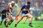 18 August 2001; John Carroll of Tipperary in action against Declan Ruth of Wexford during the Guinness All-Ireland Senior Hurling Championship Semi-Final Replay match between Wexford and Tipperary at Croke Park in Dublin. Photo by Brendan Moran/Sportsfile