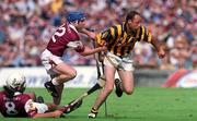 19 August 2001; Andy Comerford of Kilkenny breaks away from Kevin Broderick and David Tierney, 8, of Galway during the Guinness All-Ireland Senior Hurling Championship Semi-Final match between Kilkenny and Galway at Croke Park in Dublin. Photo by Brendan Moran/Sportsfile