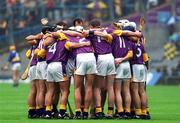 18 August 2001; The Wexford team in a huddle prior to the Guinness All-Ireland Senior Hurling Championship Semi-Final Replay match between Wexford and Tipperary at Croke Park in Dublin. Photo by Brian Lawless/Sportsfile
