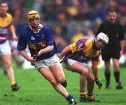 18 August 2001; Eamonn Corcoran of Tipperary in action against Paul Codd of Wexford during the Guinness All-Ireland Senior Hurling Championship Semi-Final Replay match between Wexford and Tipperary at Croke Park in Dublin. Photo by Ray McManus/Sportsfile