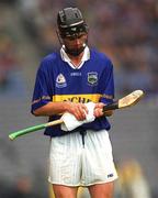 18 August 2001; Thomas Dunne of Tipperary dries his hurl before taking a free during the Guinness All-Ireland Senior Hurling Championship Semi-Final Replay match between Wexford and Tipperary at Croke Park in Dublin. Photo by Ray McManus/Sportsfile