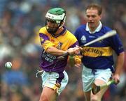 18 August 2001; Rory Mallon of Wexford clears his lines as Declan Ryan of Tipperary closes in during the Guinness All-Ireland Senior Hurling Championship Semi-Final Replay match between Wexford and Tipperary at Croke Park in Dublin. Photo by Ray McManus/Sportsfile