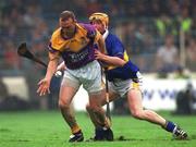 18 August 2001; Larry Murphy of Wexford in action against Eamonn Corcoran of Tipperary during the Guinness All-Ireland Senior Hurling Championship Semi-Final Replay match between Wexford and Tipperary at Croke Park in Dublin. Photo by Brendan Moran/Sportsfile
