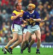 18 August 2001; Larry Murphy of Wexford in action against Paul Ormonde of Tipperary during the Guinness All-Ireland Senior Hurling Championship Semi-Final Replay match between Wexford and Tipperary at Croke Park in Dublin. Photo by Ray McManus/Sportsfile