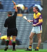 18 August 2001; Nicky Lambert of Wexford is shown a yellow card by referee Pat Horan during the Guinness All-Ireland Senior Hurling Championship Semi-Final Replay match between Wexford and Tipperary at Croke Park in Dublin. Photo by Ray McManus/Sportsfile