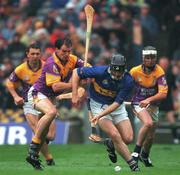 18 August 2001; Mark O'Leary of Tipperary in action against Adrian Fenlon of Wexford during the Guinness All-Ireland Senior Hurling Championship Semi-Final Replay match between Wexford and Tipperary at Croke Park in Dublin. Photo by Brendan Moran/Sportsfile