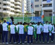 1 August 2016; Members of the Ireland squad watch the Irish tricolour being raised during their team's welcome ceremony in the Olympic Village ahead of the start of the 2016 Rio Summer Olympic Games in Rio de Janeiro, Brazil. Photo by Brendan Moran/Sportsfile