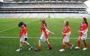 27 September 2010; 300 children from all over the country realised their dreams today when they got to play a match in the world-famous Croke Park stadium as part of the 2010 Vhi Cúl Day Out. The Vhi Cúl Day Out is a nationwide competition which was open to all 80,000 children who attended one of the 1000 Vhi GAA Cúl Camps held over the course of the summer. Today’s lucky 300 winners got to train and play a match in the world-famous stadium. GAA heroes such as Bernard Brogan, Anthony Daly and Eoin Kelly as well as other hurling, football, camogie and handball stars around the country were there to work with the children on the day to help them develop their skills and reinforce their passion for the game. Pictured are, from left, Caoimhe McCabe, age 6, from Bohermeen, Co. Meath, Ciara O'Riordan, age 7, from Whitechurch, Co. Cork, Ciara McInerney, age 7, from Ennistymon, Co. Clare and Ciara Shanley, age 8, Canningstown, Co. Cavan, as they leave the Croke Park pitch after receiving their medals. Vhi GAA Cúl Day Out 2010, Croke Park, Dublin. Picture credit: Brendan Moran / SPORTSFILE