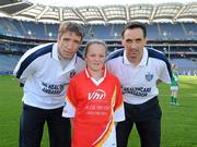 27 September 2010; Layla Alvey, from Donegal, with Kildare manager Kieran McGeeney and Cavan footballer Paul Brady. Vhi GAA Cúl Day Out 2010, Croke Park, Dublin. Picture credit: Oliver McVeigh / SPORTSFILE