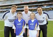 27 September 2010; Darragh Gilhooley and Michaela Harte, from Leitrim, with Kildare manager Kieran McGeeney, Declan Moran, Director of Marketing and Business Development Vhi, and Cavan footballer Paul Brady. Vhi GAA Cúl Day Out 2010, Croke Park, Dublin. Picture credit: Oliver McVeigh / SPORTSFILE