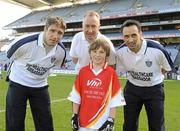 27 September 2010; Jamie Farrell, from Louth, with Kildare manager Kieran McGeeney, Declan Moran, Director of Marketing and Business Development Vhi, and Cavan footballer Paul Brady. Vhi GAA Cúl Day Out 2010, Croke Park, Dublin. Picture credit: Oliver McVeigh / SPORTSFILE