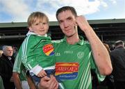 3 October 2010; Kilmallock's Paudie O'Dwyer celebrates with his nephew Callum O'Dwyer, aged 2, after victory over Emmets. Limerick County Senior Hurling Championship Final, Emmets v Kilmallock, Gaelic Grounds, Limerick. Picture credit: Diarmuid Greene / SPORTSFILE
