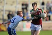 3 October 2010; Richard Carey, Coleraine Eoghan Rua, in action against Colin Devlin, Ballinderry Shamrocks. Derry County Senior Football Championship Final, Ballinderry v Coleraine Eoghan Rua, Celtic Park, Derry. Picture credit: Oliver McVeigh / SPORTSFILE